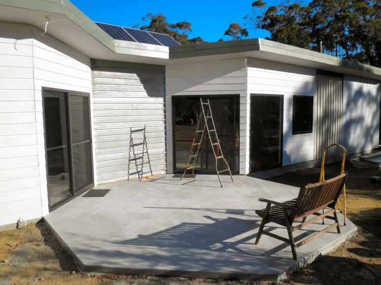 The front patio is foinished and the you can see the weatherboarding so far.  Eventually this will be covered by a pergola with wisteria.